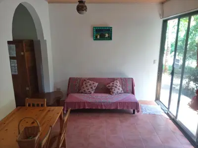a living room with a couch and a table at Blanconejo de Montezuma in Montezuma