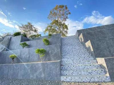 a set of concrete stairs with plants on top at Hotel PZ Country Club & Conference Center in San Isidro