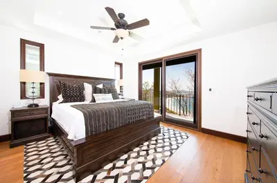 a bedroom with a bed and a ceiling fan at 360 Splendor Del Pacifico Residences in Playa Flamingo