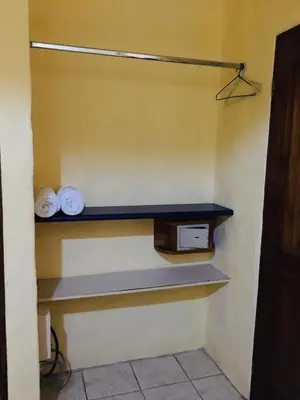 a shelf in a room with two plates on it at Hotel Casa Esmeralda in Sámara