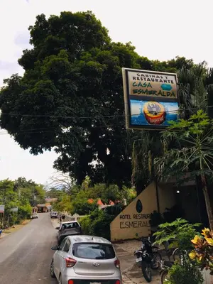 a street with cars parked on the side of a road at Hotel Casa Esmeralda in Sámara