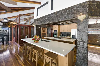 a kitchen with a large island in a room at Playa Potrero - beachfront Villa, big private pool - Casa Bella Catalina in Potrero