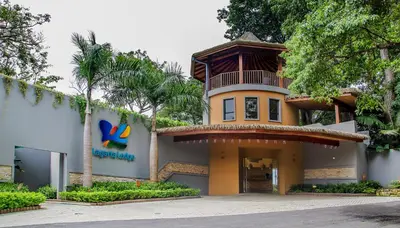 a building with a sign on the side of it at Hotel Boutique Lagarta Lodge in Nosara