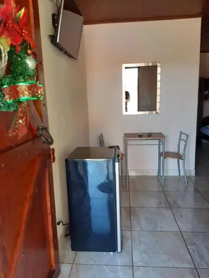 a television sitting on the floor in a room at Cabañas San Isidro in Ángeles