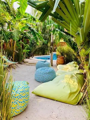 a group of colorful objects sitting on the ground at Ten North Tamarindo Beach Hotel in Tamarindo