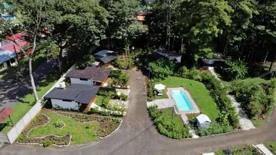 an overhead view of a house with a swimming pool at Almendros Eco-Villas in Fortuna