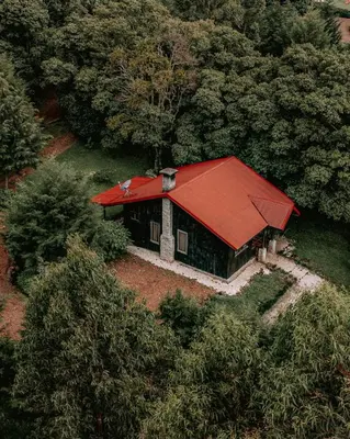 an aerial view of a house with a red roof at Hotel & Spa Escondite de la Montaña in Sabana Redonda