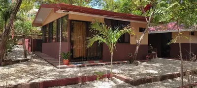 a house in the middle of a forest at Villa De Los Monos, casitas equipadas en Guanacaste in Matapalo