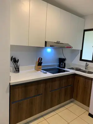 a kitchen with a sink and a counter top at Cocomarindo Condo #72 in Coco