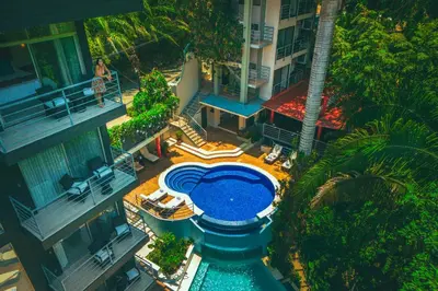 an overhead view of a swimming pool in the middle of a building at Jungle Vista Boutique Hotel in Manuel Antonio