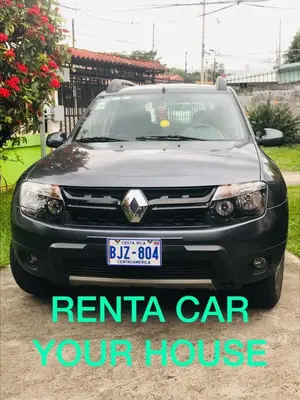 a black car parked in a driveway with the words rental car your house at Hotel Your House in Alajuela City