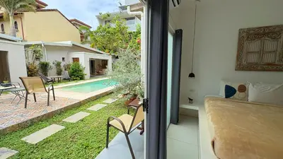 a view of a pool from a house at La Ramona Charming Hotel in Tamarindo