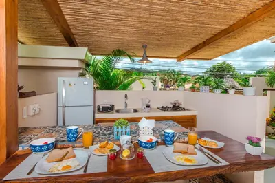 a table with food on it in a kitchen at La Ramona Charming Hotel in Tamarindo