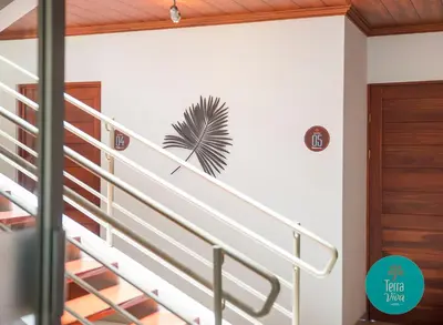 a staircase in a house with a palm sticker on the wall at Hotel Terra Viva in Quesada