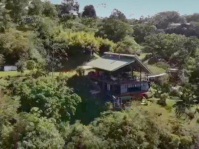 an aerial view of a house in the forest at Volare in Turrialba