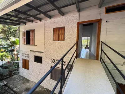 a house with a staircase leading to a door at Casa Susen in Montezuma