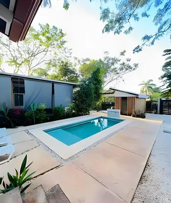 a swimming pool in the backyard of a house at Nirvana Beach Home in Paraíso