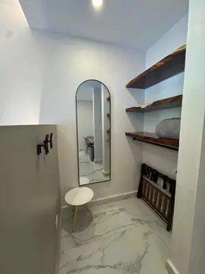 a dressing room with a mirror and a stool at Tamarindo Sunshine in Tamarindo