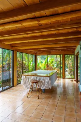 a large room with a bath tub on a floor at Jodokus Inn in Montezuma