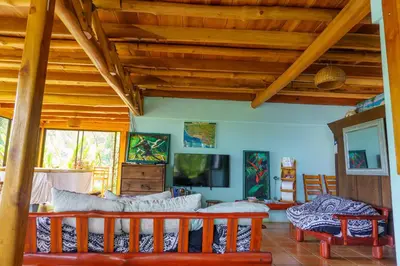 a living room with a couch and a tv at Jodokus Inn in Montezuma
