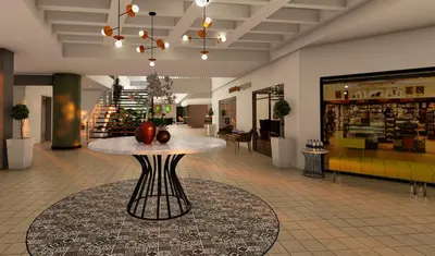 a lobby with a table in the middle of a store at Holiday Inn San Jose La Sabana by IHG in San José