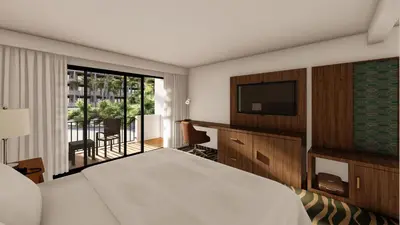 a hotel room with a bed and a television at Holiday Inn San Jose La Sabana by IHG in San José