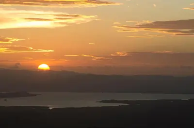 a sunset over a body of water at Hotel Trópico Monteverde in Monteverde Costa Rica