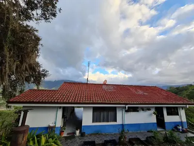 a house with a red and white roof at Villas Valle Bello in Ujarrás