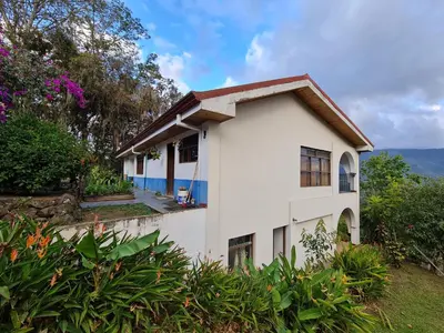 a white house with a roof at Villas Valle Bello in Ujarrás