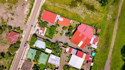 an overhead view of a house with red roof at Cabinas Bahía Uvita - Marino Ballena National Park Lodge in Uvita