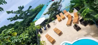 an overhead view of a building with benches and trees at Sunshine Sanctuary Boutique Jungle Lodge in Montezuma