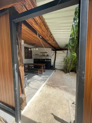 a view of a patio with a wooden ceiling at Beach Cabinas in Santa Teresa Beach