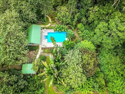 an overhead view of a house in the forest at Tropical Paradise Bungalows in Pital