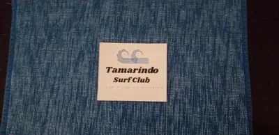 a sign that says tamarindo surf club at Pura Vida Condo in Tamarindo