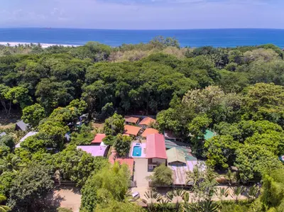 an aerial view of a house in the forest at Tropical Beach in Uvita