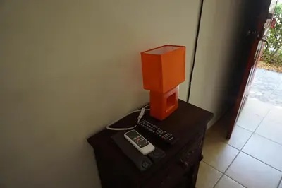 an orange box on top of a table with a remote control at Villa Vilar in Coco