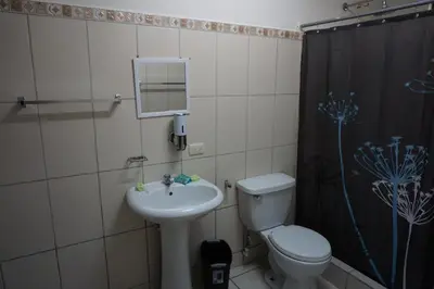 a bathroom with a sink and a toilet and a shower at Villa Vilar in Coco