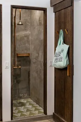 a door with a bag hanging on it at The Nomadic Hotel in Nosara