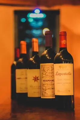 four bottles of wine sitting on a table at Hotel Buenos Aires in Santa Teresa Beach