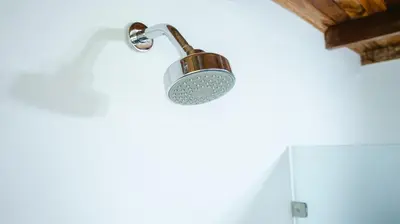 a light fixture on the wall of a room at Hotel Buenos Aires in Santa Teresa Beach