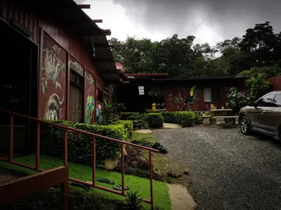 a house with graffiti on the side of it at Greemount Hotel in Monteverde Costa Rica