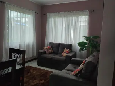 a living room with a couch and a chair at Casa la Fortuna 1 in Fortuna