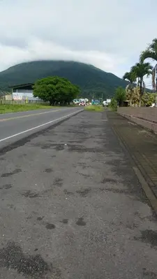 an empty road with a mountain in the background at Casa la Fortuna 1 in Fortuna