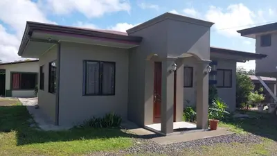 a small house with a porch at Casa la Fortuna 1 in Fortuna