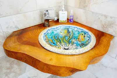 a wooden sink with a fish design on it at Casa Laureles in Bejuco
