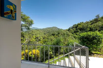 a balcony with a view of a mountain at Casa Laureles in Bejuco