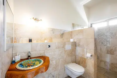a bathroom with a sink and a toilet at Casa Laureles in Bejuco