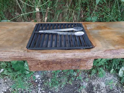 a wooden table with tongs on top of it at Villa privada con hidromasaje Herradura Jaco in Herradura