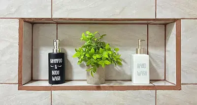 a shelf with two bottles and a plant on it at Casa Jungle Monteverde B&B in Monteverde Costa Rica