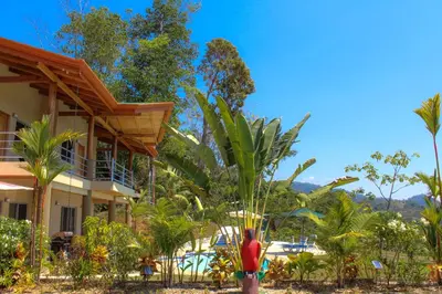 a man standing in front of a resort at Vista Villas in Ojochal